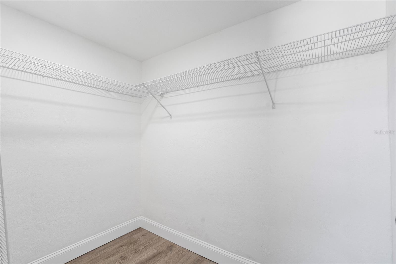 Primary bedroom walk-in closet.