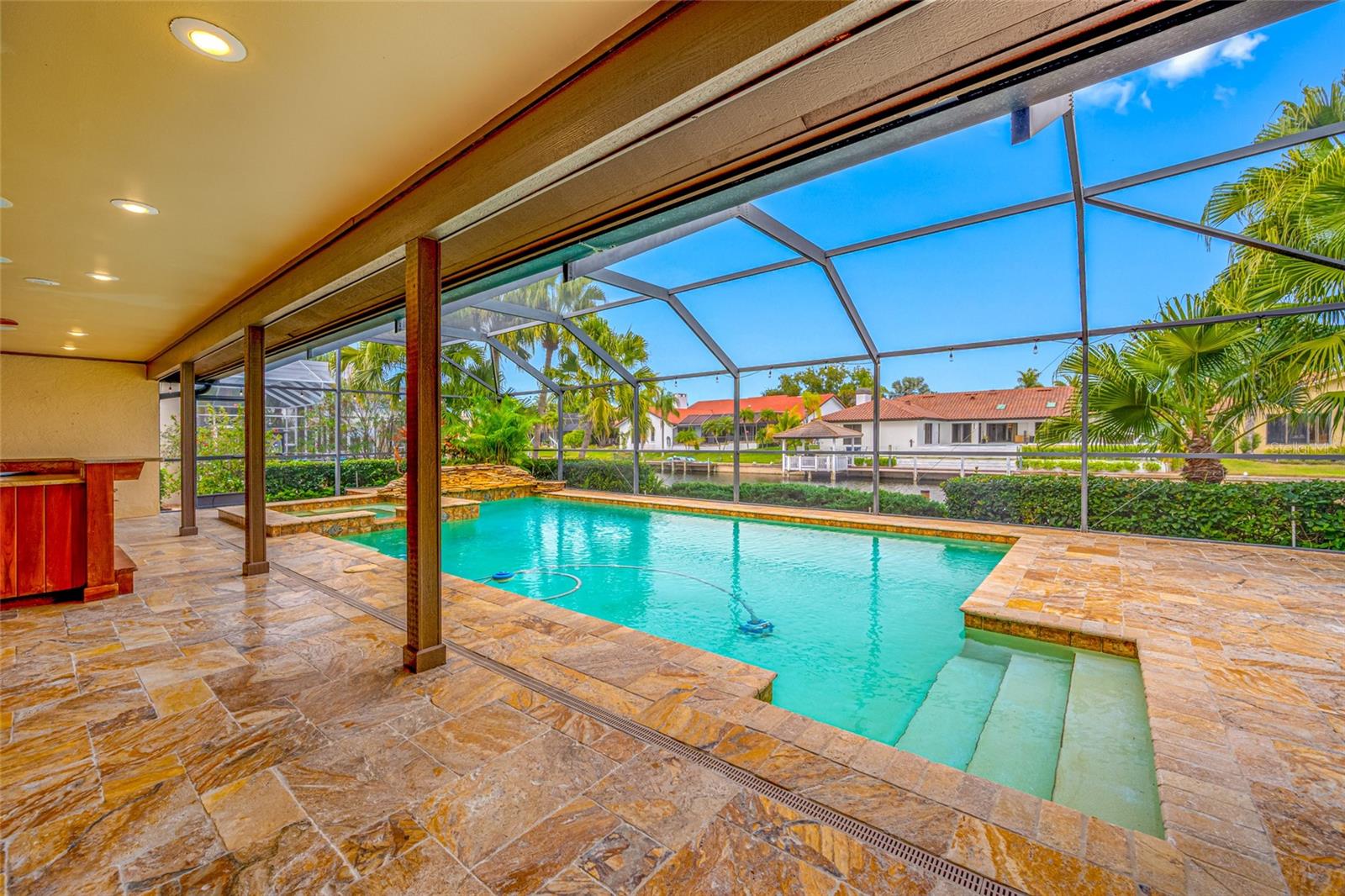 Pool, spa and waterfall with water views