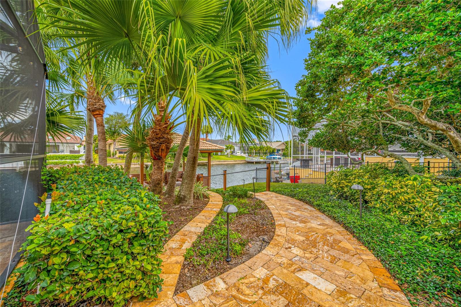 Travertine pathway to water and gazebo