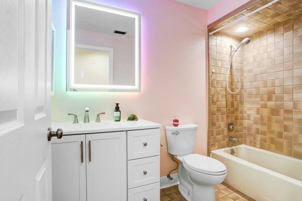 Hall Bath with Updated Vanity and Mirror