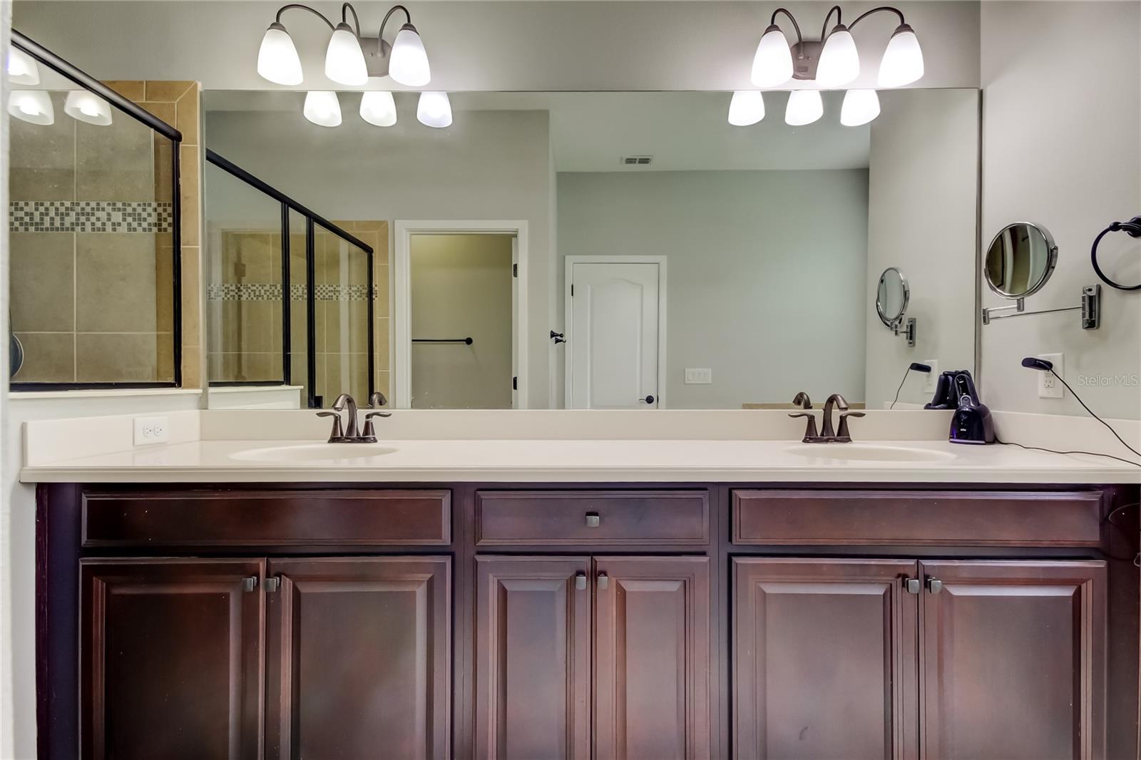 ground floor primary en suite bath with dual vanity
