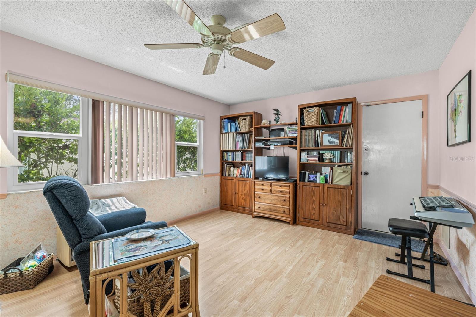 The family room/den is adjacent to the kitchen with access to the single car attached garage.