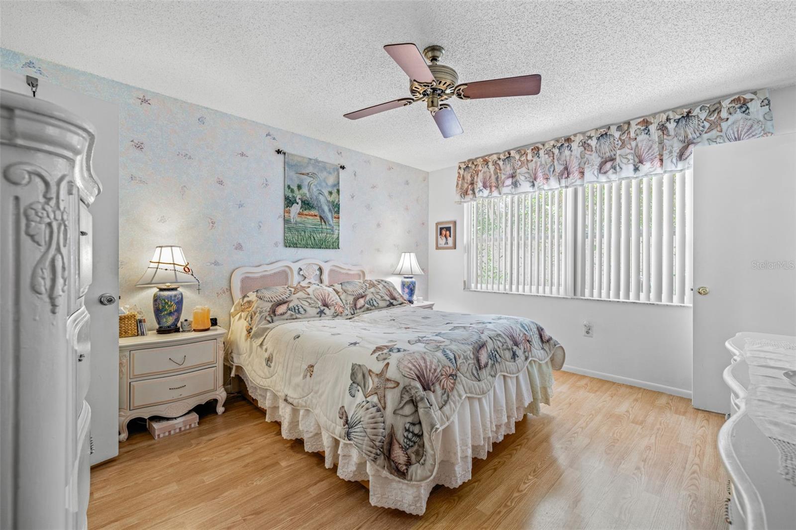 The primary bedroom is private with the window looking out to the private rear patio.