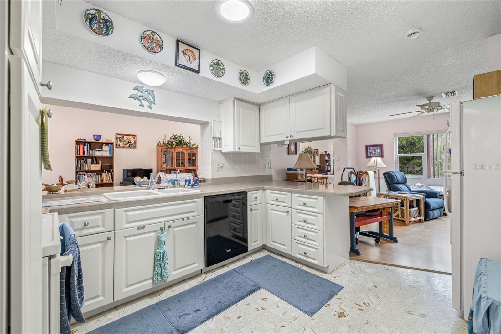 The kitchen opens to the family room/den, as well a pass-through to the Great room!
