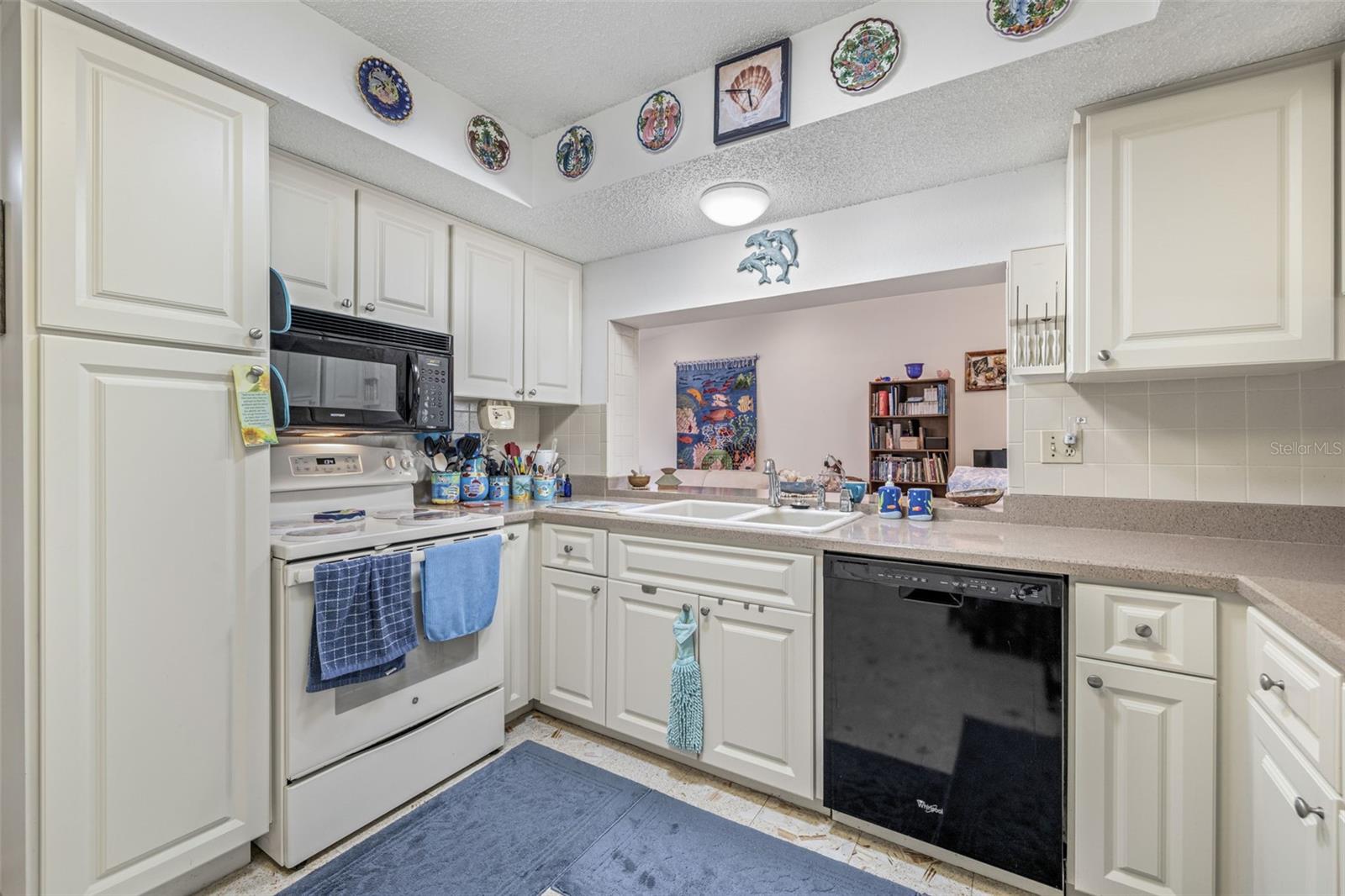 Appliances included are the refrigerator, range, microwave and dishwasher.
