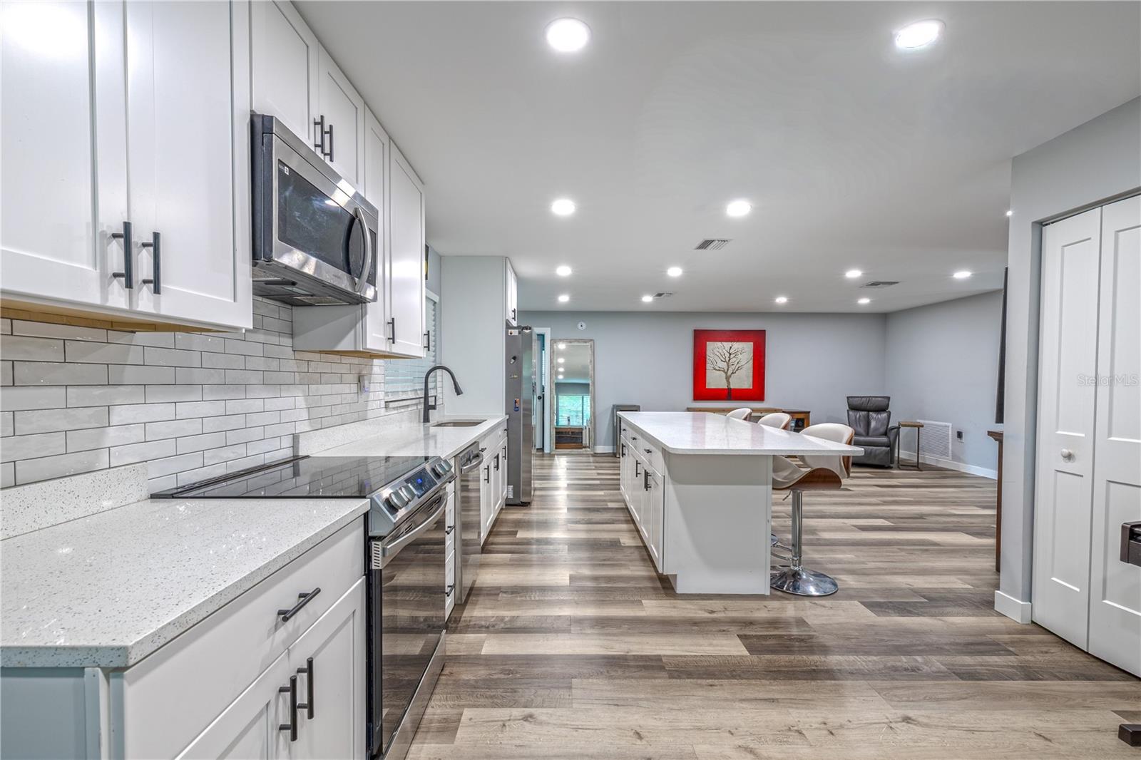 Kitchen layout with seamless connection to dining and living areas for easy entertaining.