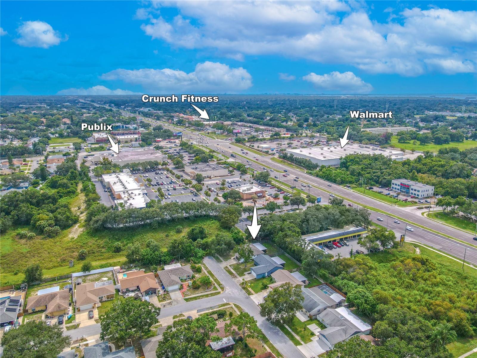 Aerial view highlighting nearby shopping, dining, and convenience.