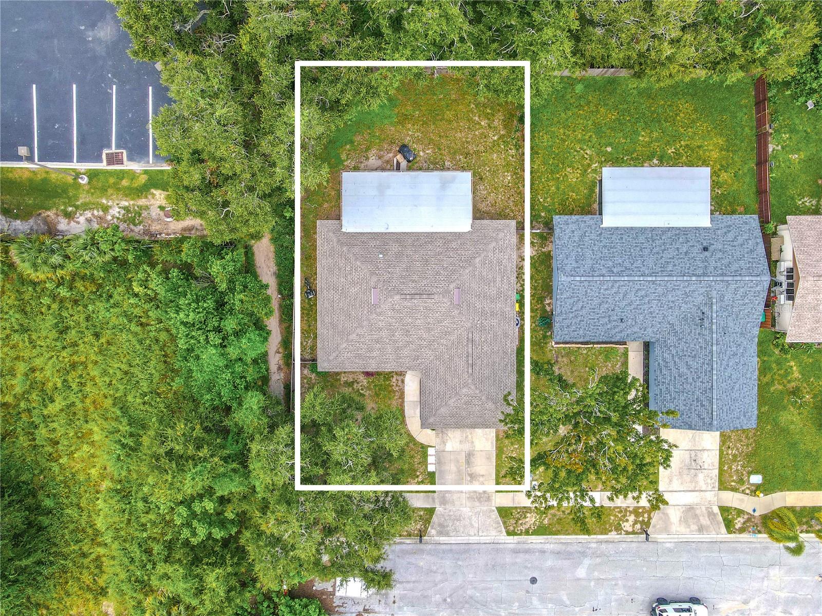 Overhead view of the property with outlined lot boundaries.