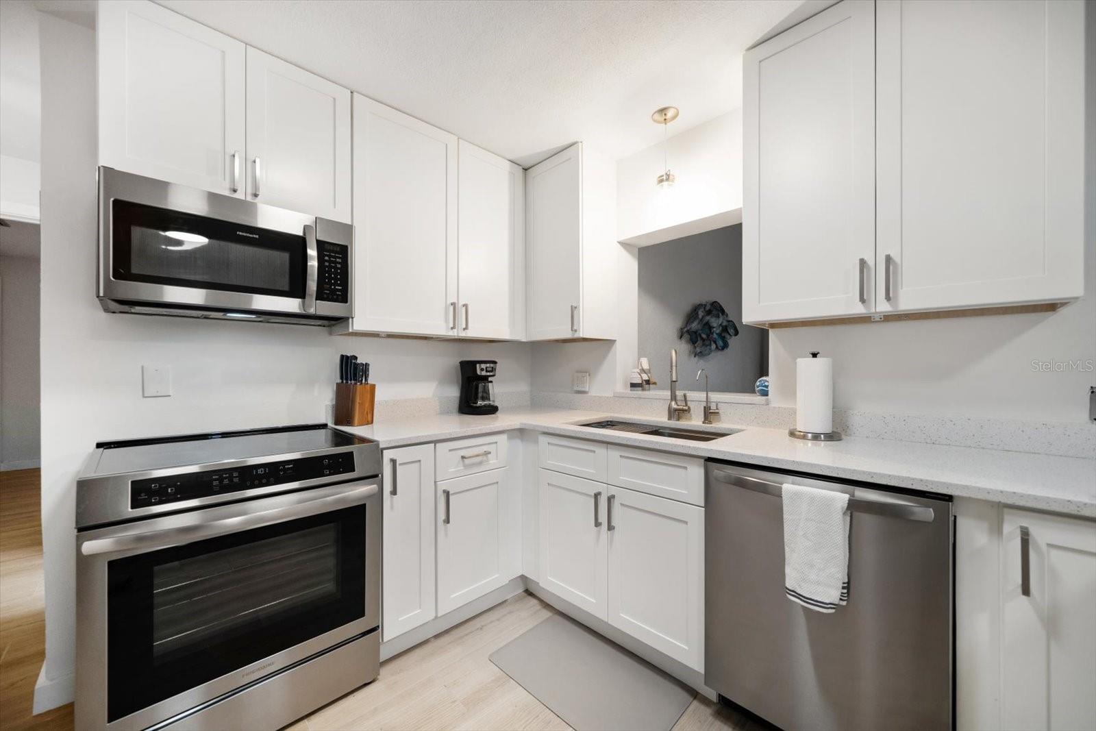 Fully equipped new stainless appliances includes an induction oven, and Quartz counters.