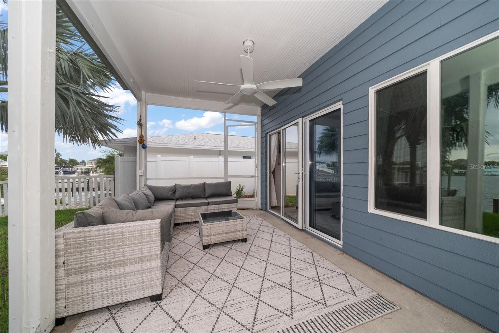 Porch area is accessed through attractive Nano Door system, multi-panel folding glass wall system that creates an easy transition from interior to outdoor living space.