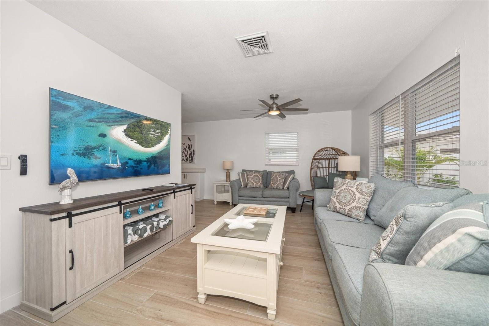 Great room. Sit back and relax-all the work is done in this COMPLETELY furnished beach property where coastal living is enjoyed by all. SWIM-FISH-PLAY all day!