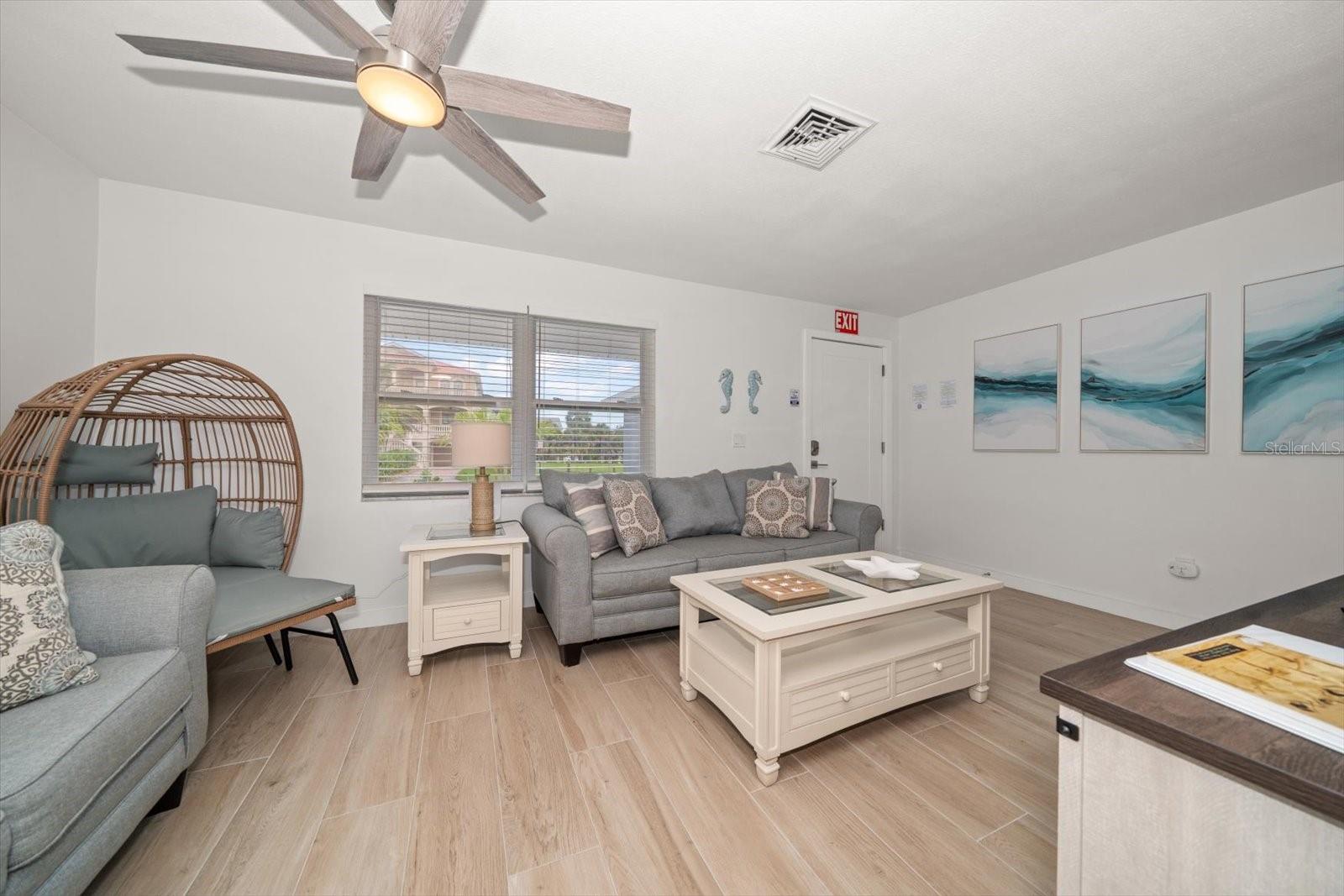 Spacious great room has attractive tile flooring for easy maintenance.