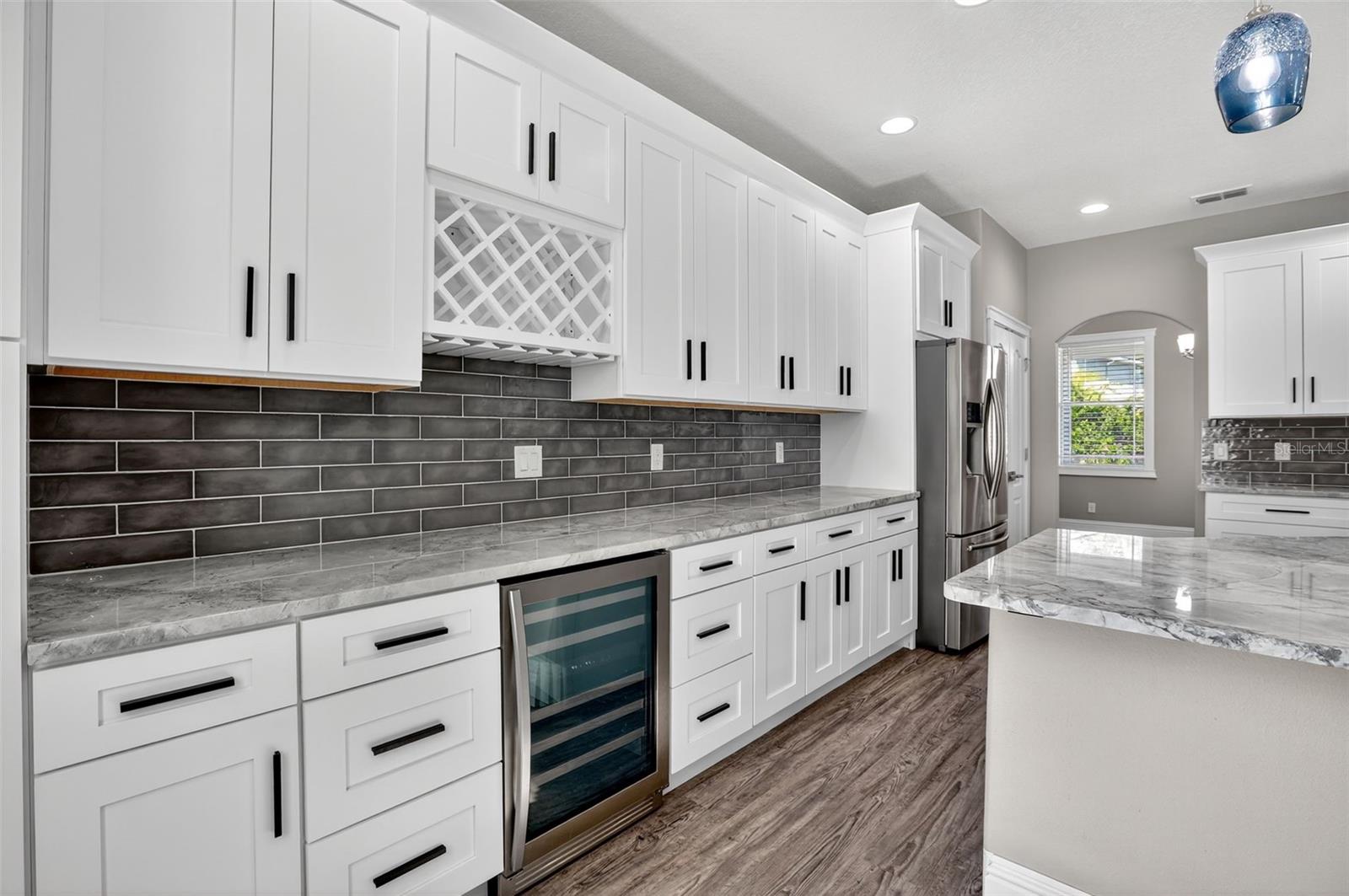 Wine rack & beverage fridge make a great bar area.