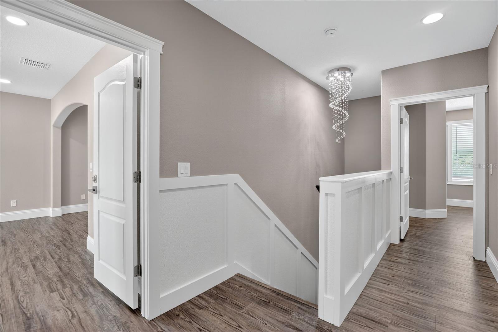 Wainscotting continues up to the second floor & on the banister.