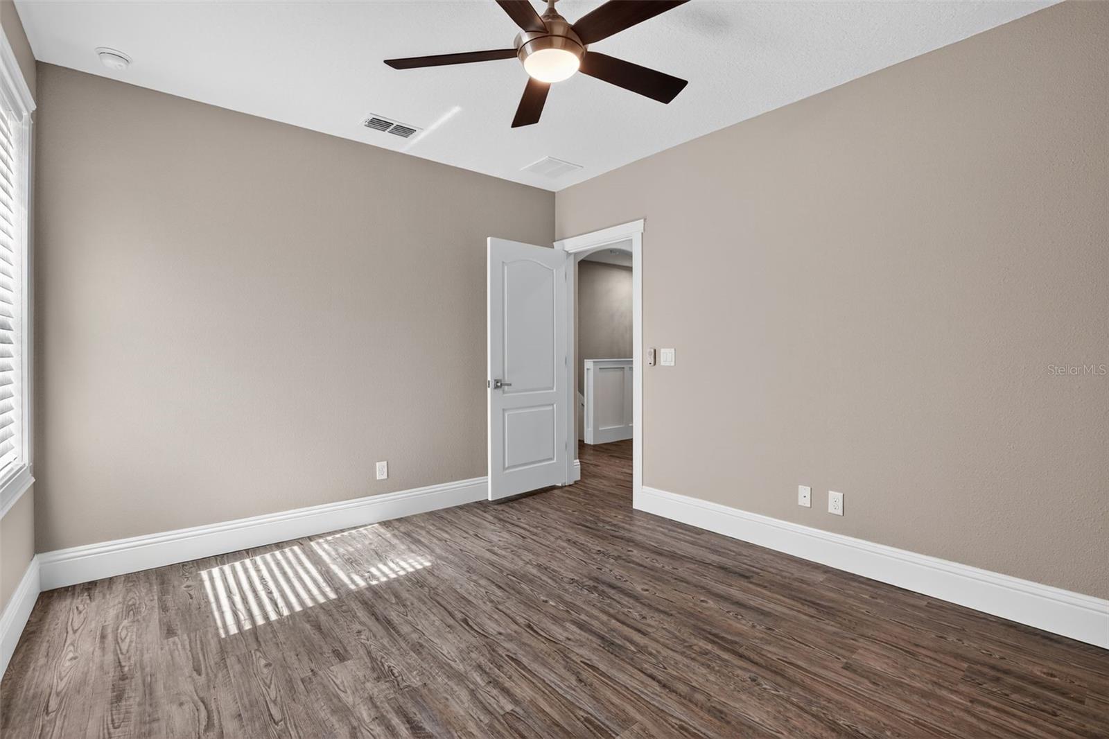 2nd Guest Bedroom has a nice layout to accommodate a queen bed set with 2 nightstands & dresser.