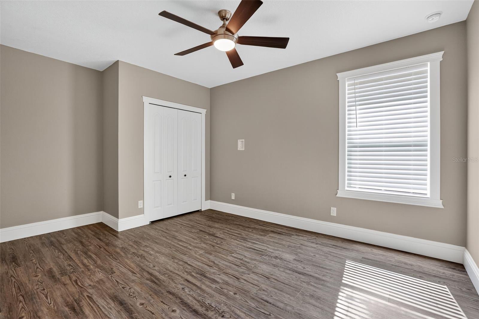 It also has a nice view of the backyard & pond & you guessed it, more custom shelving in the closet! Check out the 7 1/4 in baseboards too (which can be found throughout the entire home!)