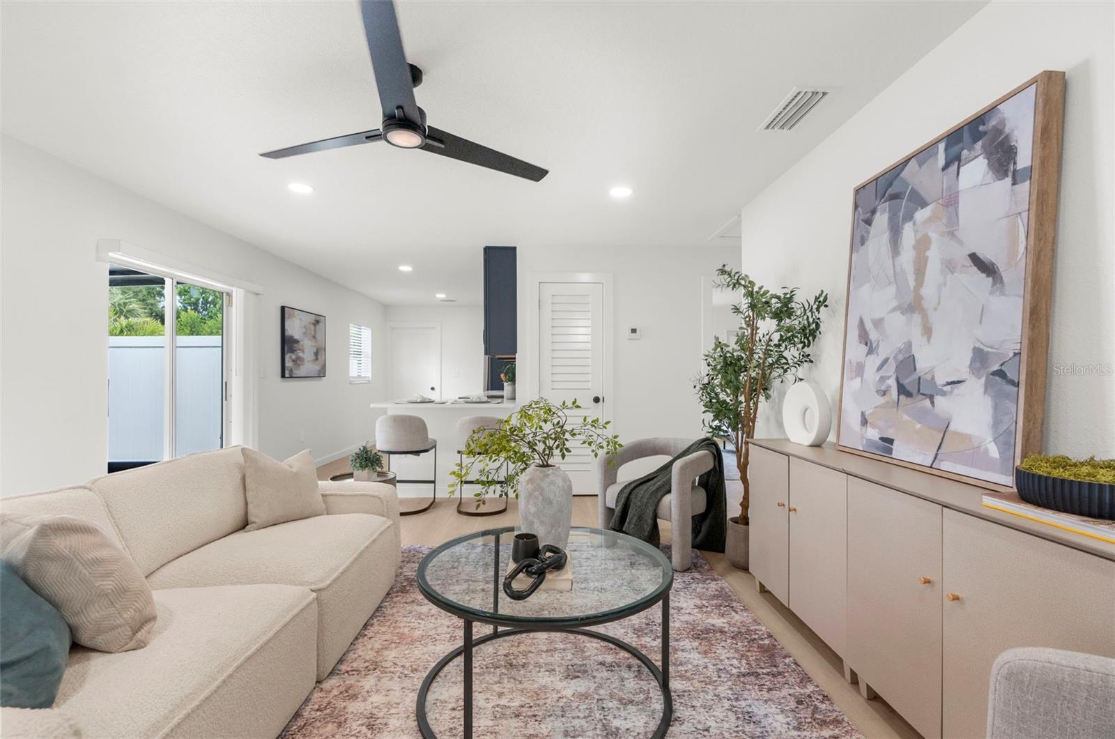 Living area looking to kitchen