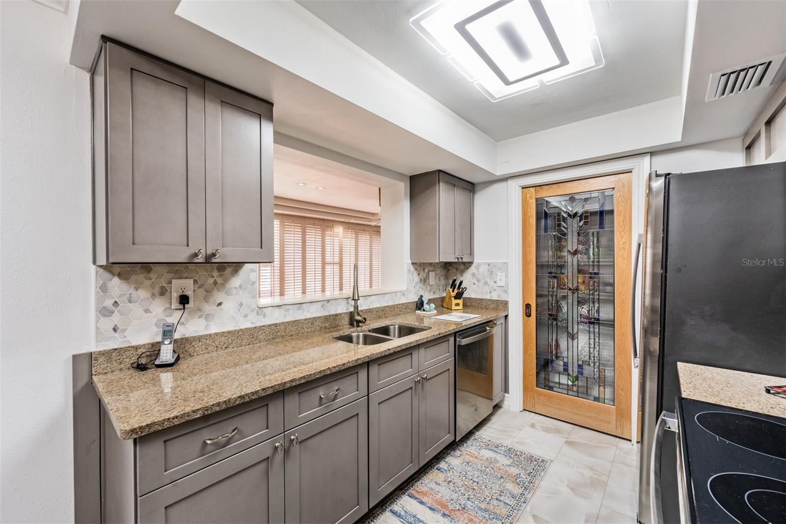 Kitchen looks into family room