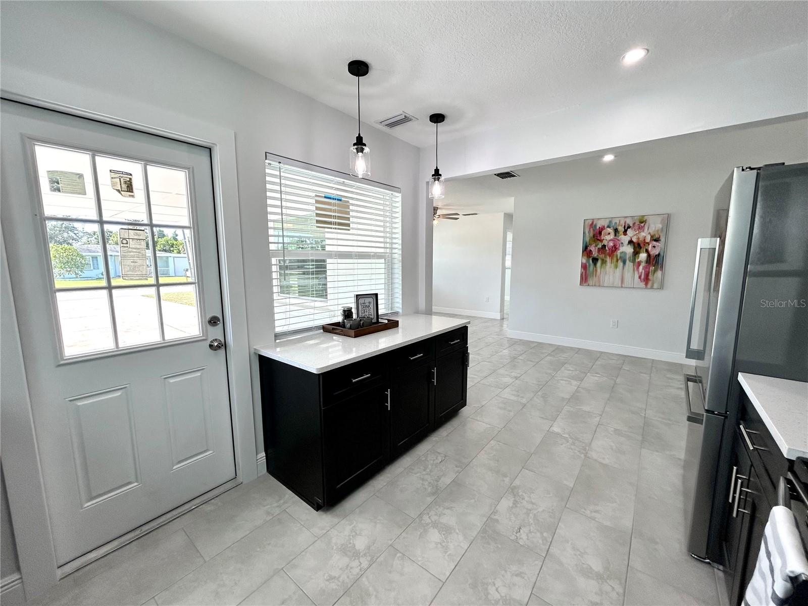 Kitchen w/ door to carport