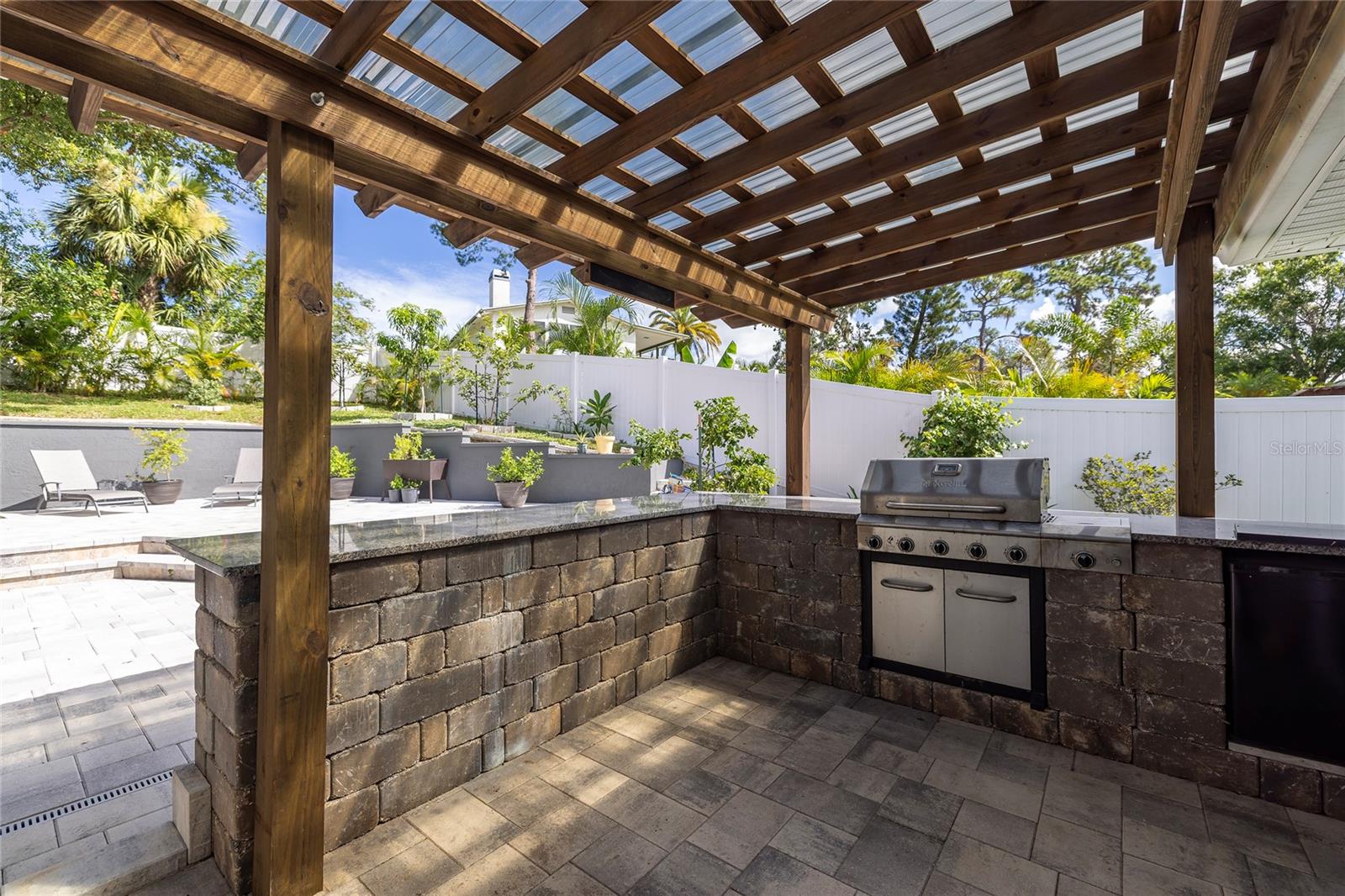 Outdoor Kitchen with Grill and Bar Seating