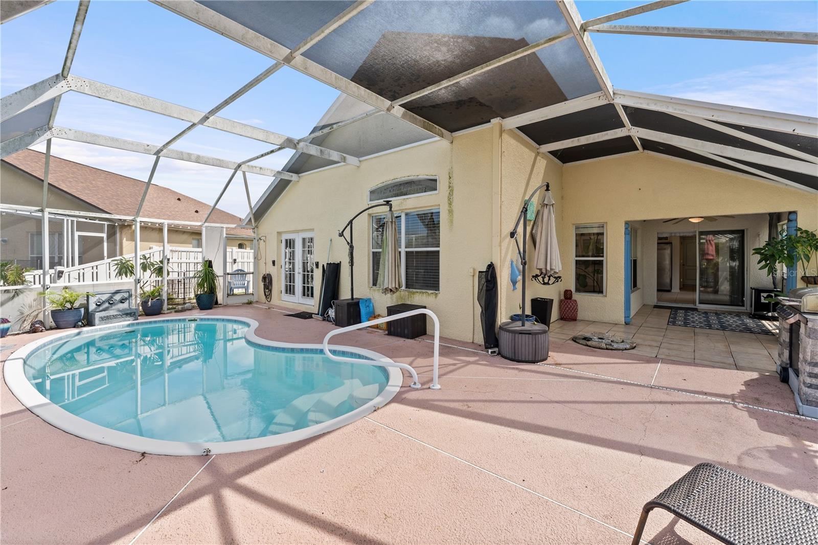 Screen Enclosed Heated Pool with Solar Panels