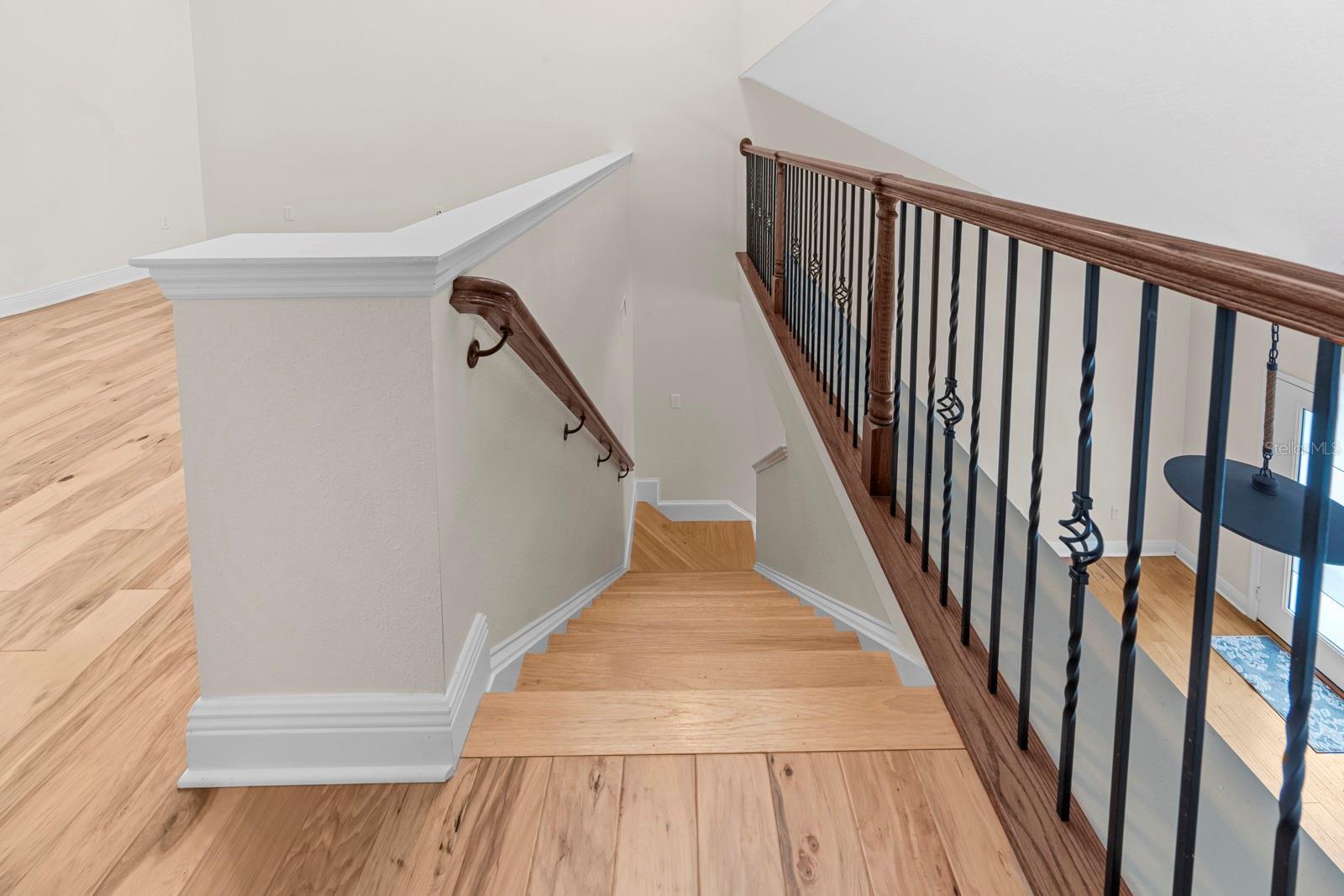 custom stair rail overlooking living area
