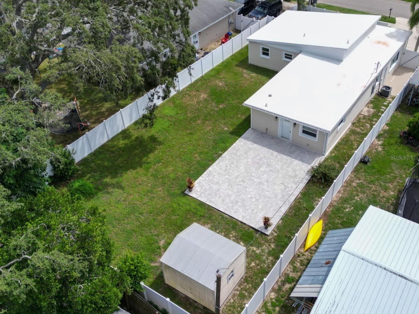 Overhead view of home and large fenced yard