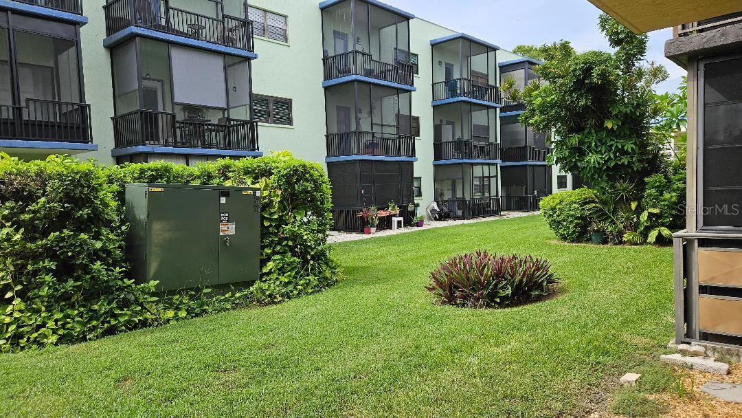 REAR OF CONDO, LOOKING OUT FROM THE SCREEN ROOM