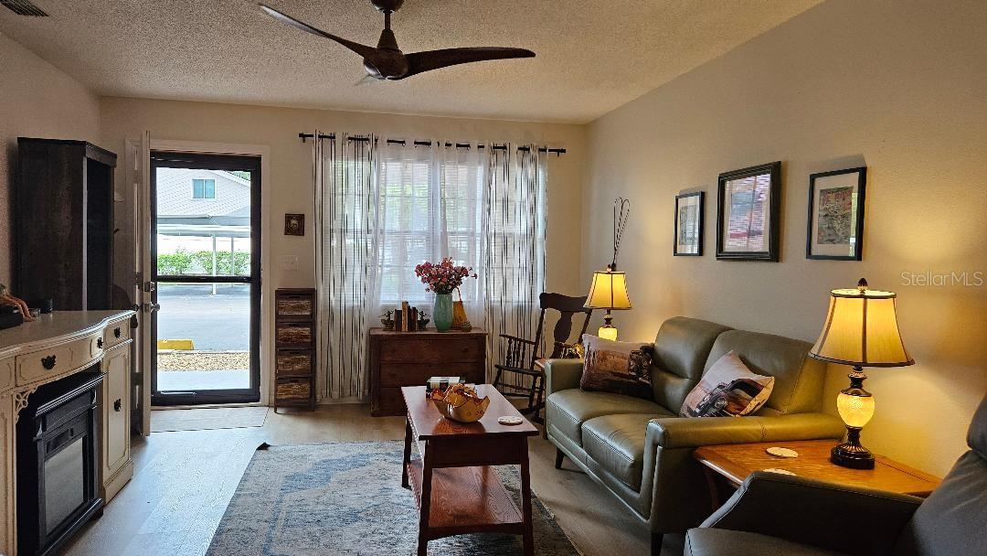 LOOKING FROM DINING AREA INTO LIVING ROOM