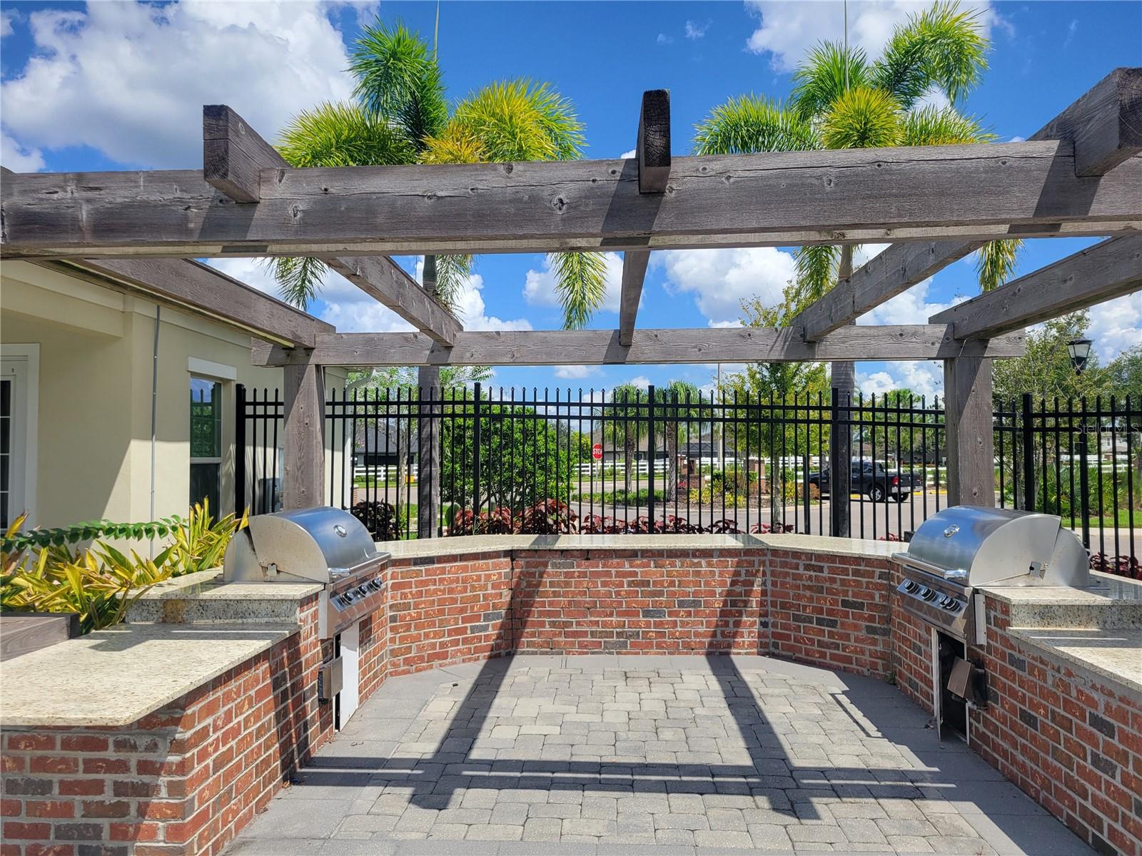 Gas grills located next to the covered patio