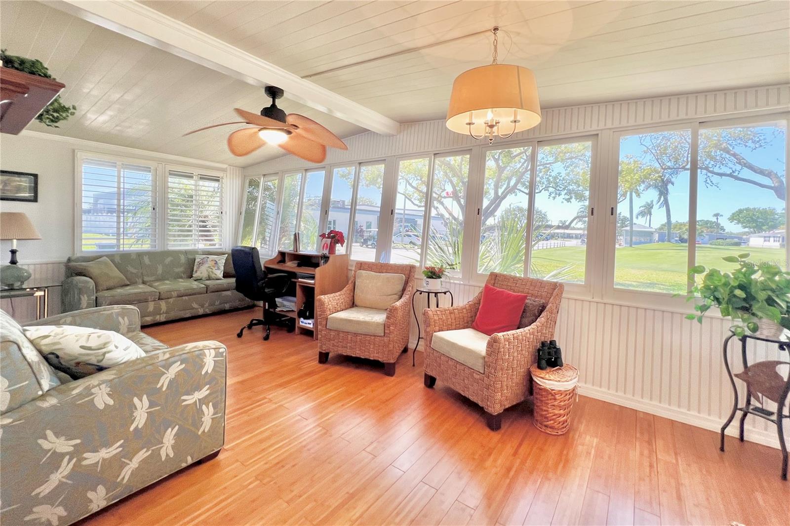 Florida room/office area with view of golf course
