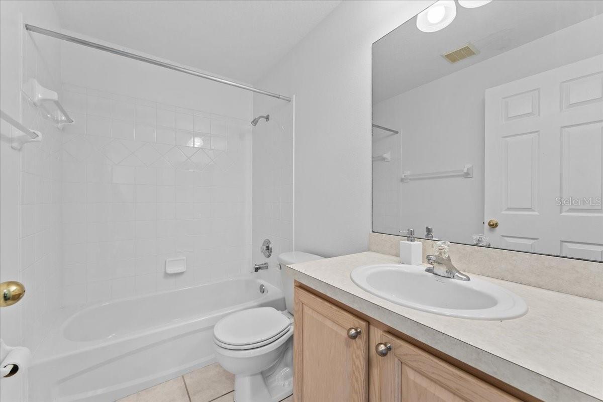 En suite bathroom features a garden tub
