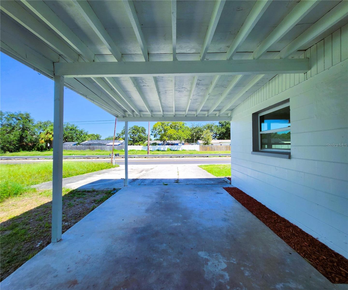 Carport, oversized driveway, parking pad