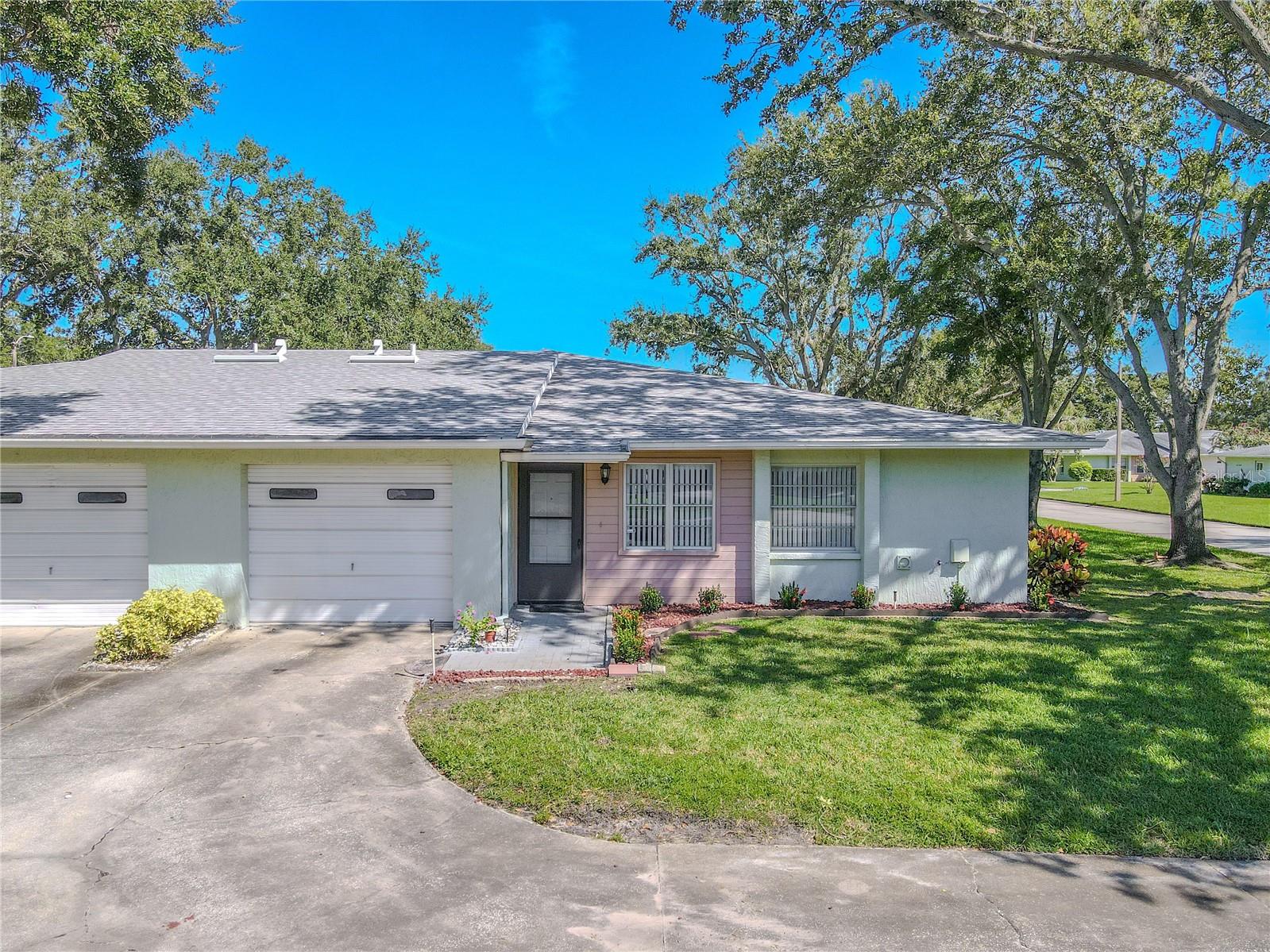 New roof (2025) tops this inviting 2-bedroom, 2-bath villa with charming curb appeal and a one-car garage.