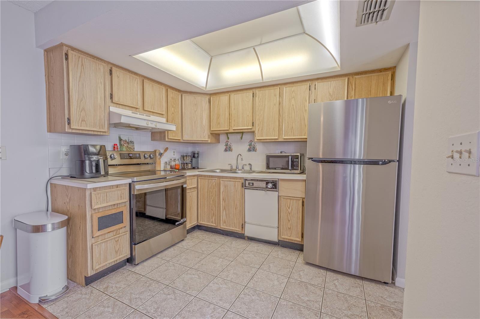 Compact kitchen footprint offering potential for updates.