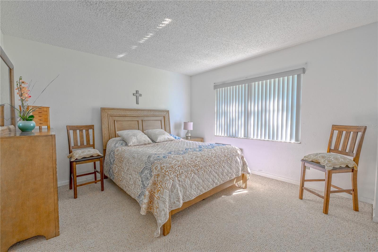 Primary bedroom with dual closets and plenty of natural light, creating a comfortable retreat.