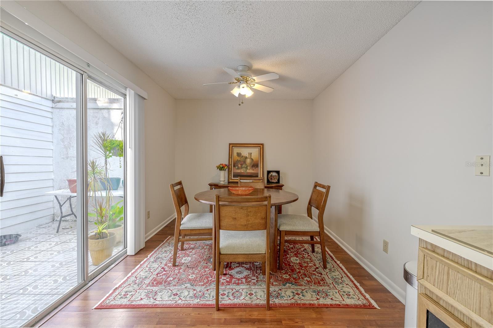 Cozy dining space perfect for weeknight dinners or hosting guests, with courtyard access nearby.