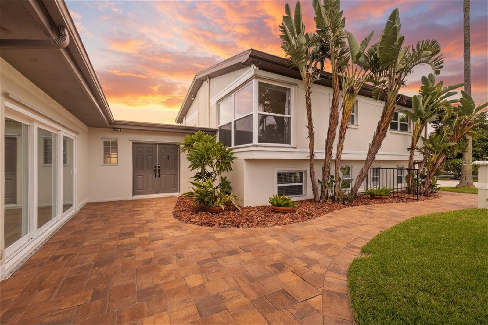 Twilight paved walkway at front door entry