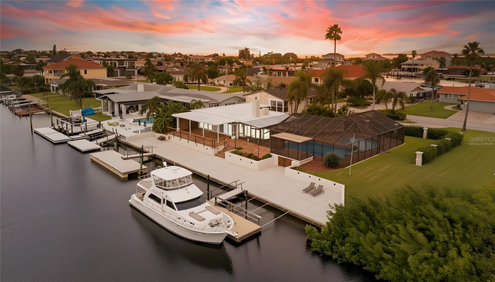 Virtually Staged photo-120 ft seawall and two large floating docks to accommodate Yacht/boats with water & 50 amp plug nearby.
