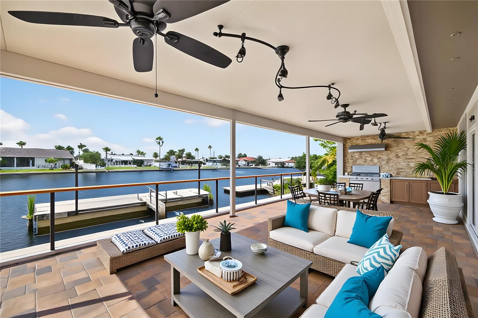 Virtually staged photo-Outdoor water view with BBQ area off Great room