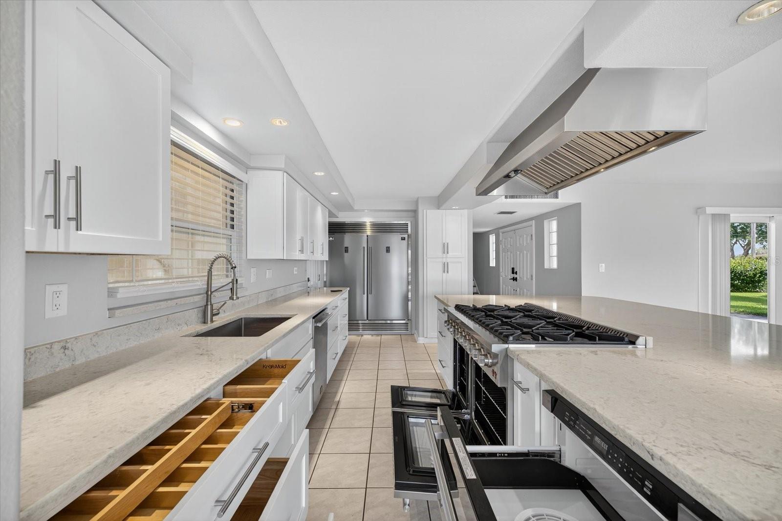 Compartmentalized drawers, 8-burner gas range, double ovens and under counter microwave