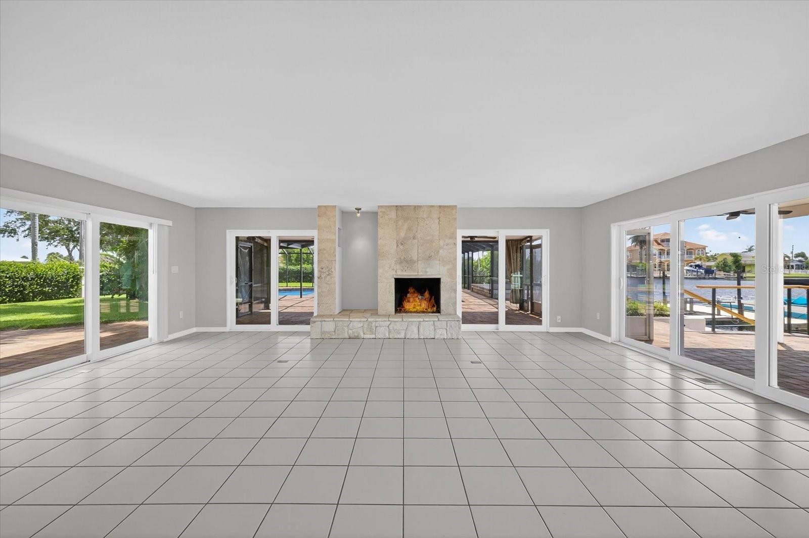 Great room w/ gas fireplace and water views