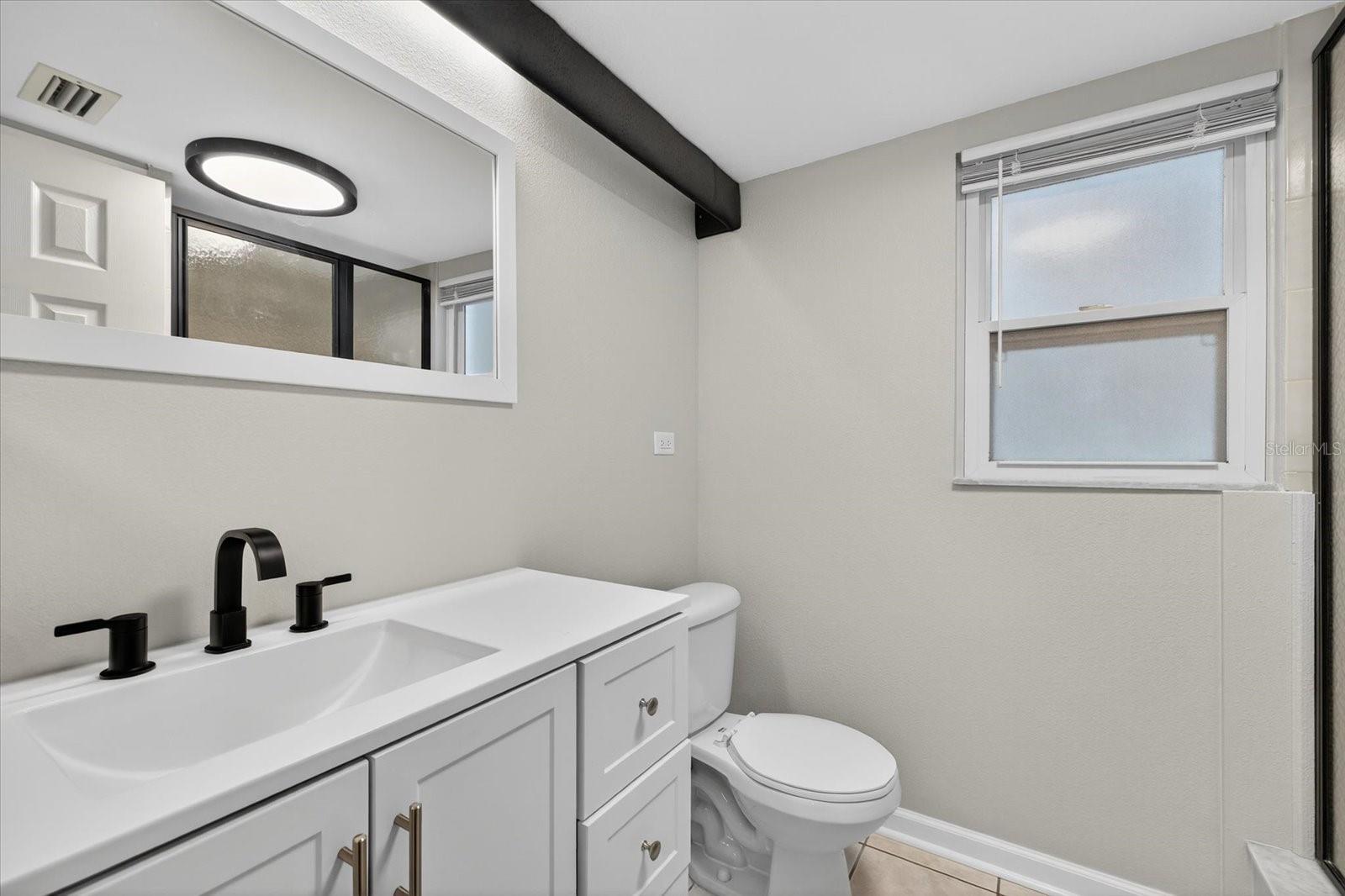 Main floor full bathroom near front entry