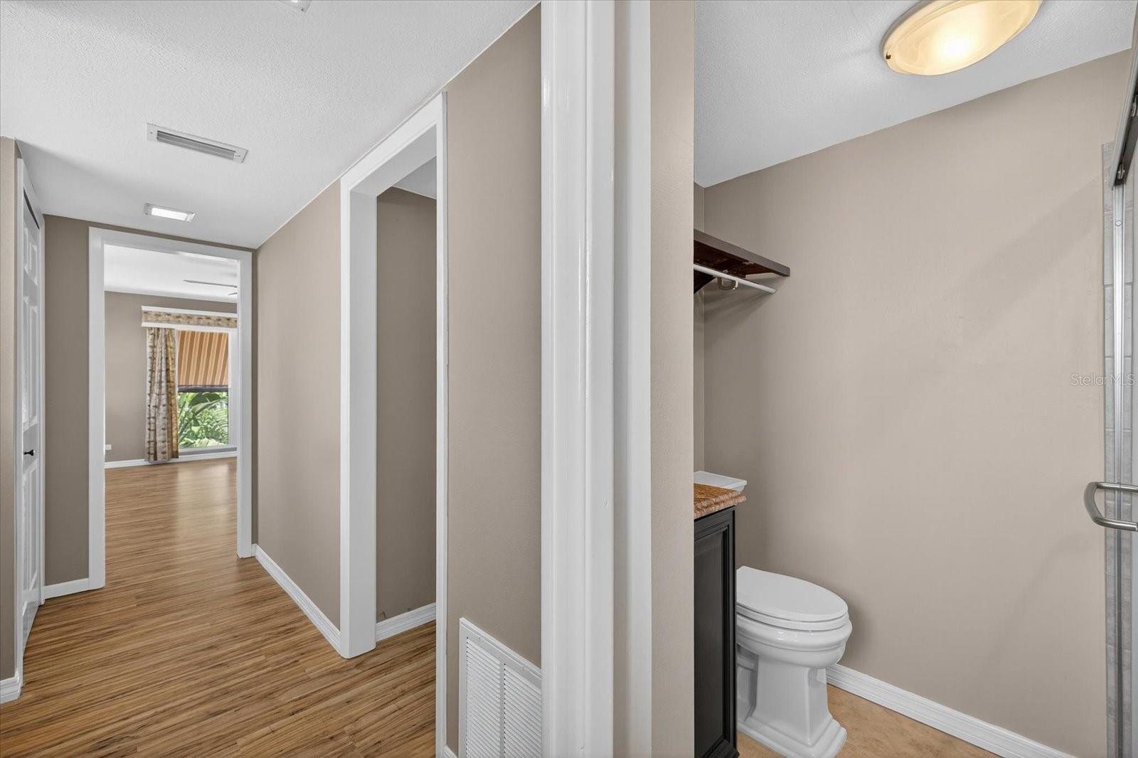 Second floor-Primary hallway with closets and doorway to stairs