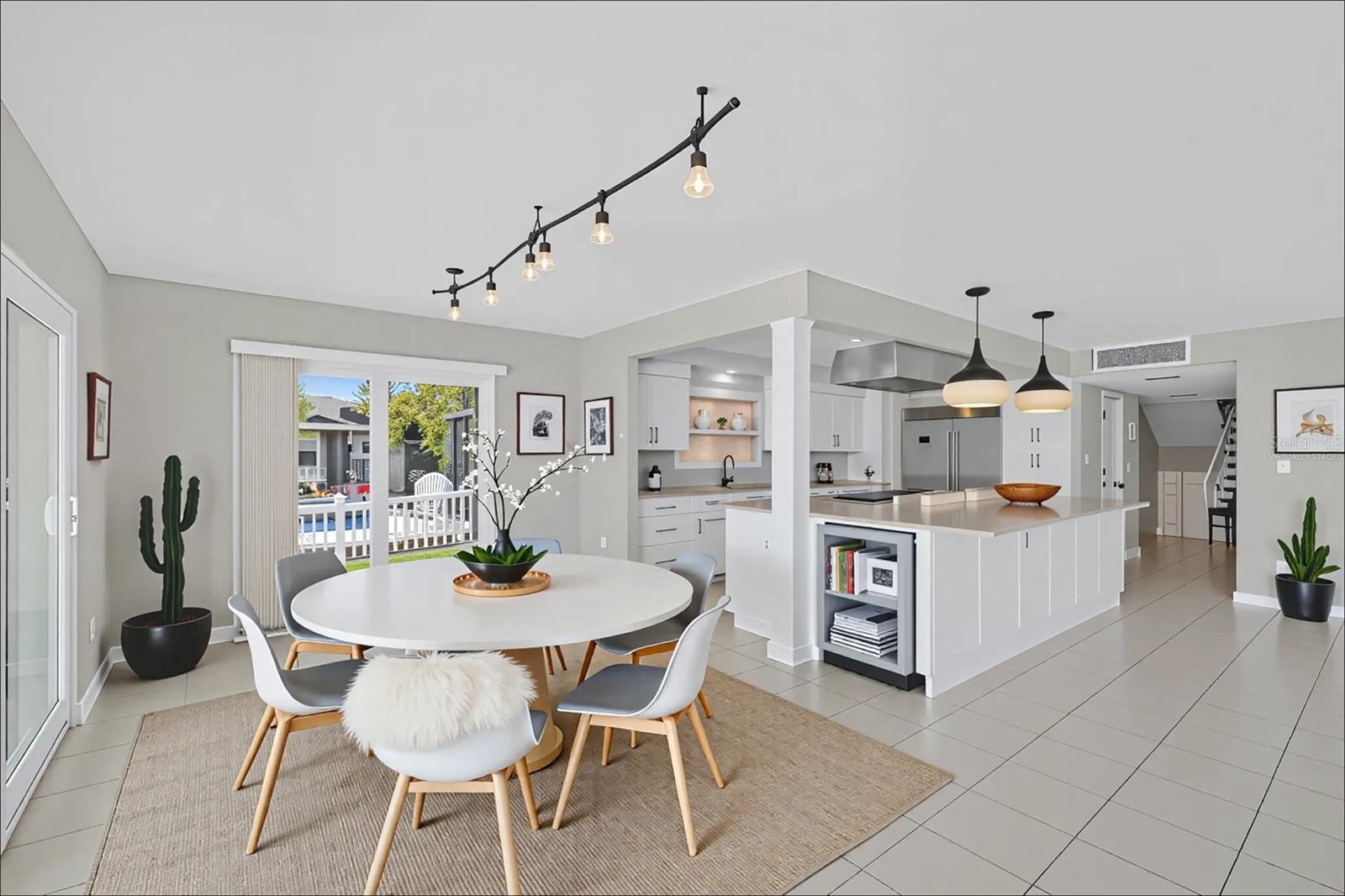 Virtually staged photo-Open kitchen with dining area