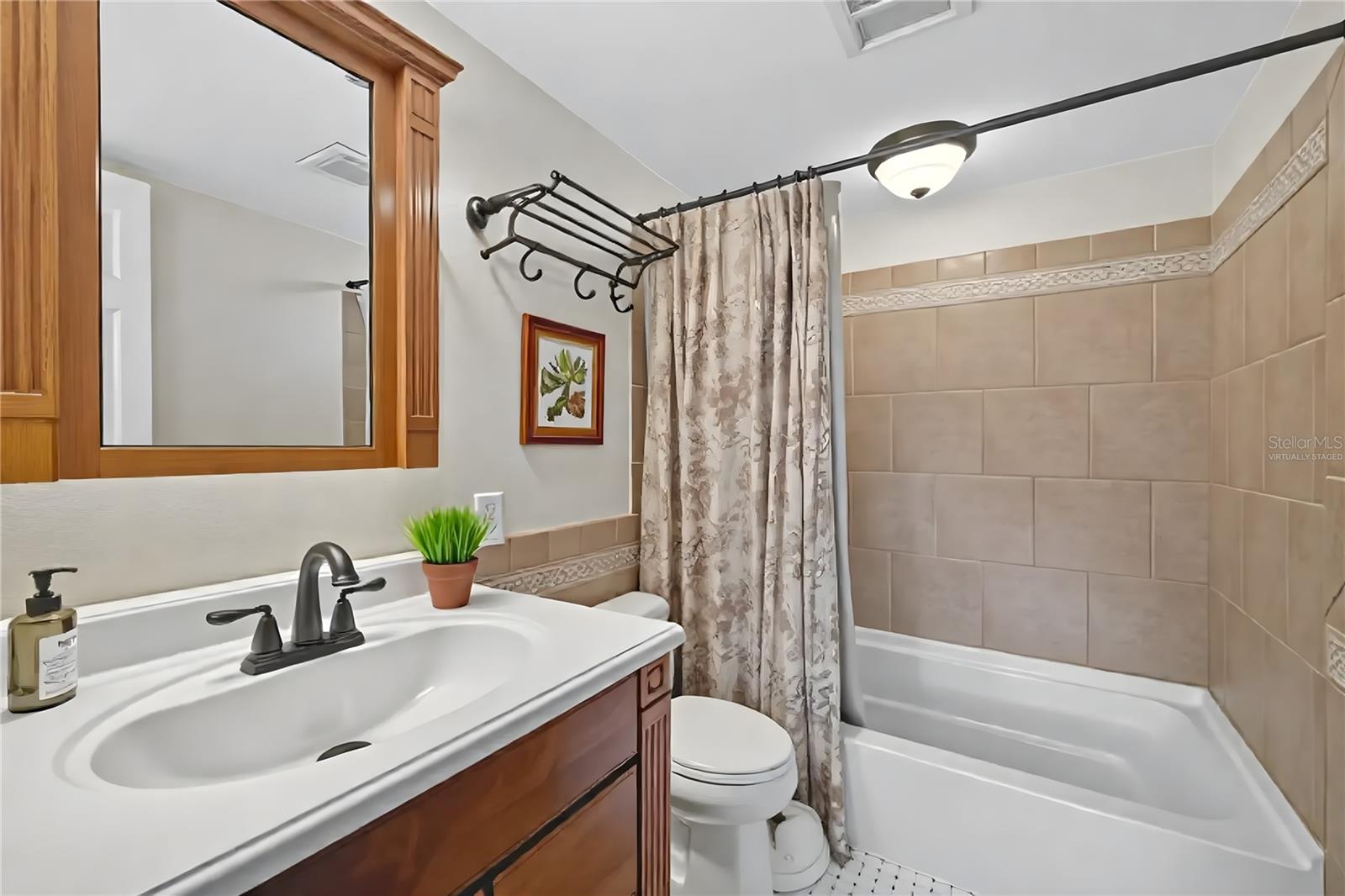 Virtually staged-second floor full bathroom with tub/shower