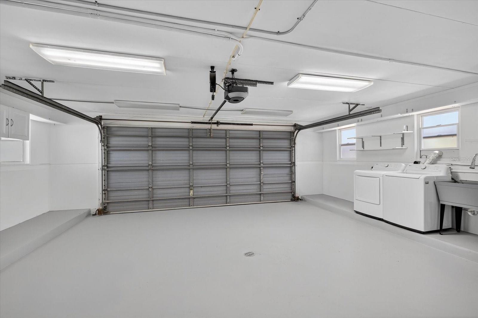 Garage with hurricane rated automatic door and laundry area