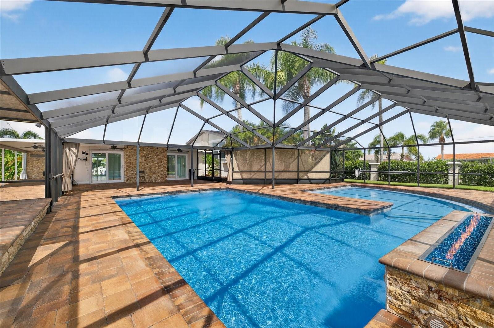 Screened outdoor pool area for hosting and relaxing