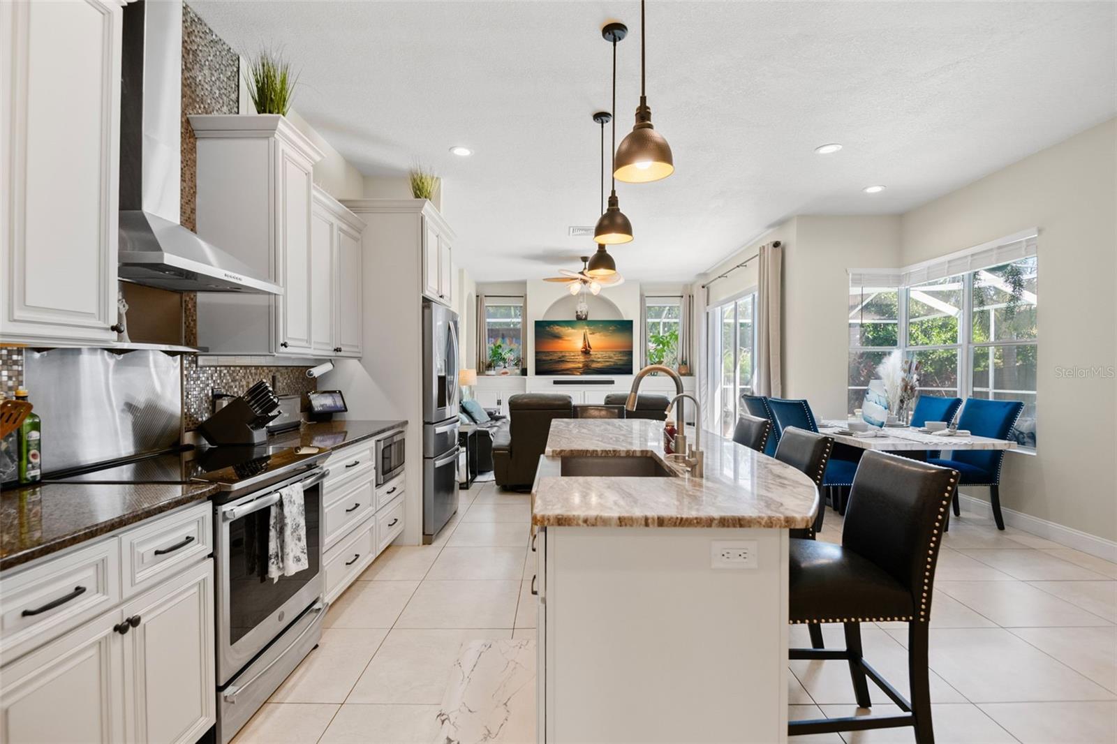 Kitchen with breakfast bar and nook - open to family room