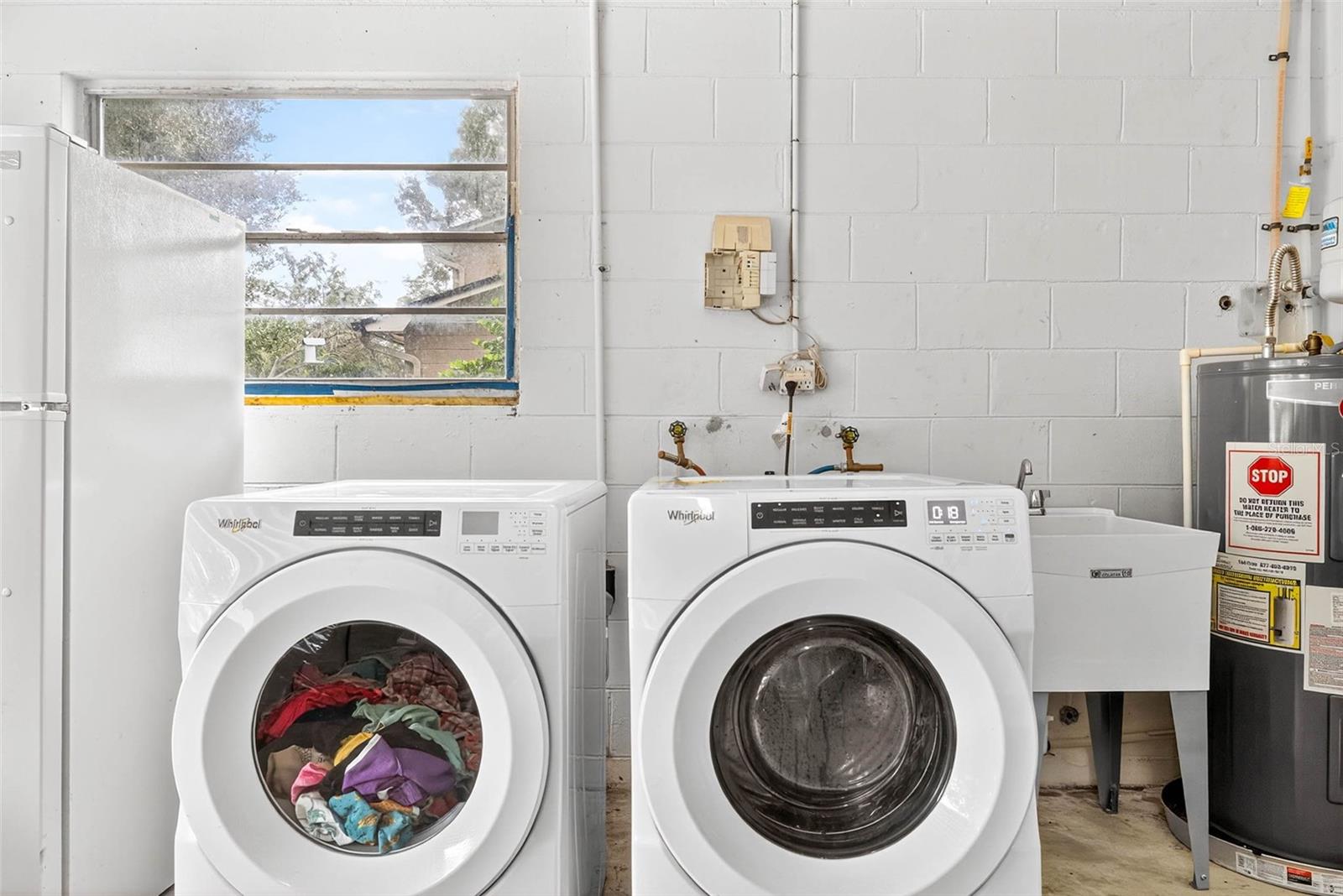 Washer & Dryer with utility sink.
